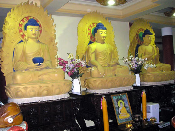 figures in shrine room of Vietnamese temple 